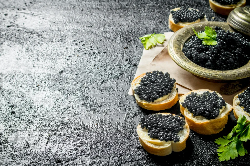 Slices of bread topped with black caviar